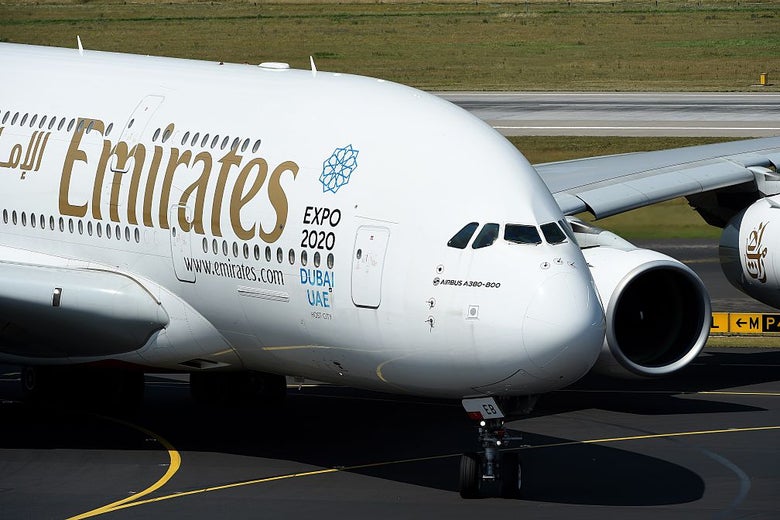 A double-decker passenger airliner on a runway.